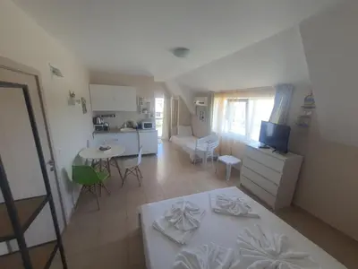 a room with a kitchen and a living room at Apartments Ivelin in Lozenets