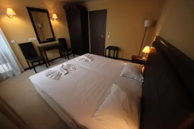 a large white bed in a hotel room at Menada Apartments in Royal Beach in Sunny Beach