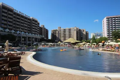 a large swimming pool in a city with buildings at Menada Apartments in Royal Beach in Sunny Beach