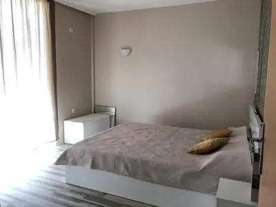 a bedroom with a bed with two pillows on it at Complex Sands Holiday Apartments in Sunny Beach