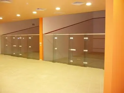 a locker room with glass doors and mirrors at Visit Sunny Beach Marina Apartments in Ravda