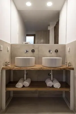 a bathroom with two sinks and a mirror at The Poolhouse in Sunny Beach
