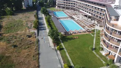 an overhead view of a swimming pool next to a building at Sunny Beach Club - Adults Only #YouthfulVibes in Sunny Beach
