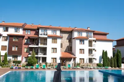 a swimming pool in front of a building at Complex Apolon in Nesebar