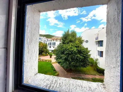an open window with a view of a yard at Vega Village Ap B39 in Sveti Vlas