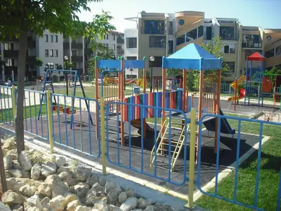 a playground in a park with a playground at Vega Village Ap B39 in Sveti Vlas