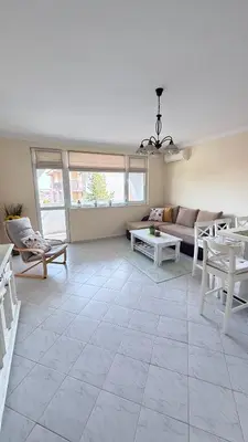 a living room with a couch and a table at Karchevi Apartment in Sveti Vlas