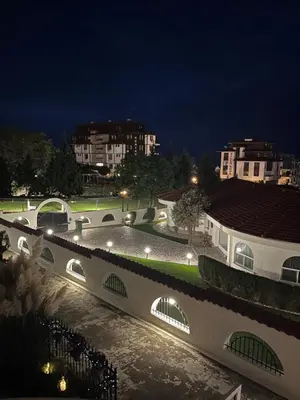 a view of a building at night with lights at Karchevi Apartment in Sveti Vlas