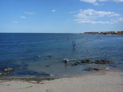 a person standing in the water at the beach at Lurd Family Hotel in Lozenets
