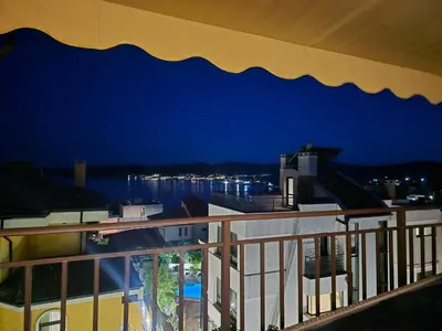 a view from a balcony at night at Apartments Provence in Sozopol