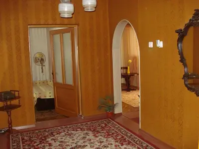 a hallway with an open door to a room at Dom Eli in Pomorie