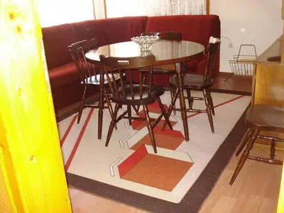 a dining room table and chairs in a room at Dom Eli in Pomorie