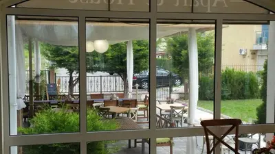 a view of a patio with tables and chairs at Aparthotel Lucky Family in Ravda