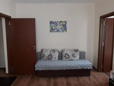 a living room with a couch and a painting on the wall at Villa Maria in Tsarevo