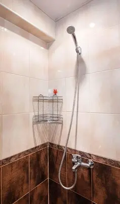 a shower with a hose in a bathroom at Flat Lora Pomorie in Pomorie