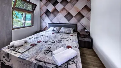 a bedroom with a bed in a room at Complex Fichoza in Varna City