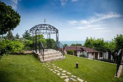 a gazebo in the yard of a house at Complex Fichoza in Varna City