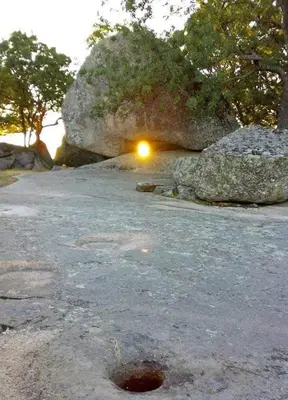 a rock with a light in the middle of it at Apartment Kraev in Primorsko