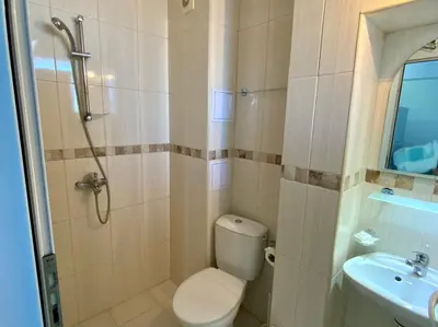 a bathroom with a toilet and a sink at Guest House Briz in Nesebar