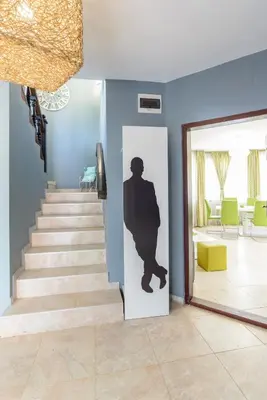 a staircase with a silhouette of a man on the door at Villa Maja in Varna City