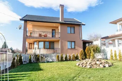 a large house with a lawn in front of it at Villa Maja in Varna City
