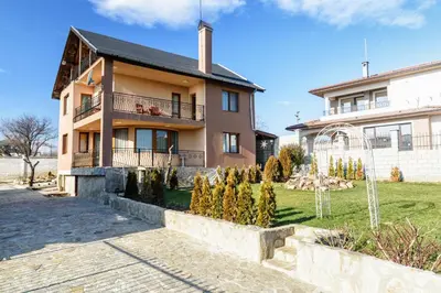 a house with a garden in front of it at Villa Maja in Varna City