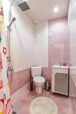 a bathroom with a toilet and a sink and a shower at Galata Residence in Varna City