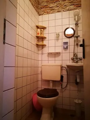 a bathroom with a toilet and a sink at Sadala Guest House in Nesebar