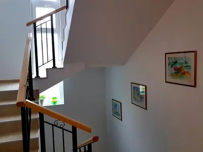 a staircase in a house with a window at Belvedere Apartments in Byala