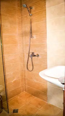a bathroom with a shower and a sink at Guest House Meridi in Priseltsi