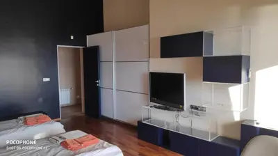 a room with two beds and a flat screen tv at Budzhaka Villa in Sozopol