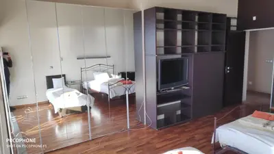 a living room with a television and a living room with a room at Budzhaka Villa in Sozopol