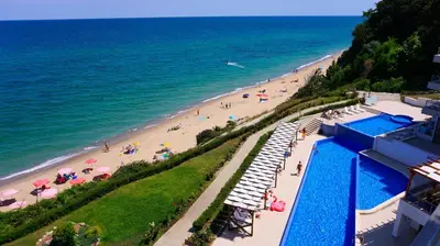 an overhead view of a beach with people and umbrellas at Бяла Виста Клиф - Byala Vista Cliff in Byala