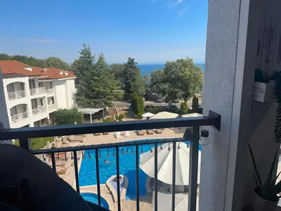 a balcony with a view of a swimming pool at Paradise Bay D8 Apartment in Sozopol