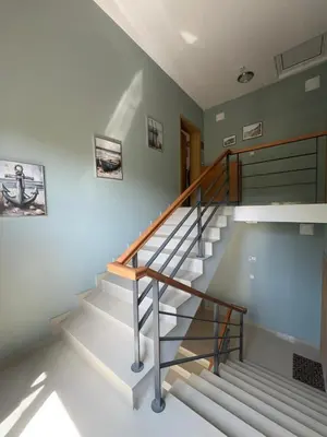 a set of stairs in a house with a stair case at Paradise Bay D8 Apartment in Sozopol