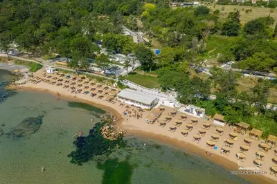 an aerial view of a beach with chairs and umbrellas at Apartments in Sunny Island Complex in Chernomorets