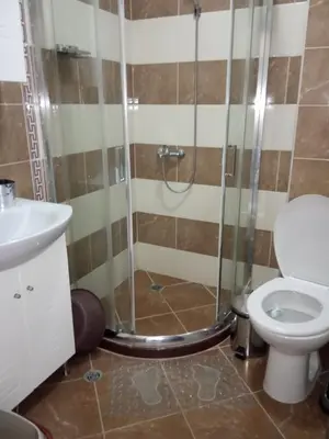 a bathroom with a shower and a toilet at Apartment Bliznaci in Pomorie