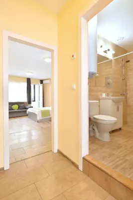 a bathroom with a toilet and a sink at Central studio 1 in Burgas City