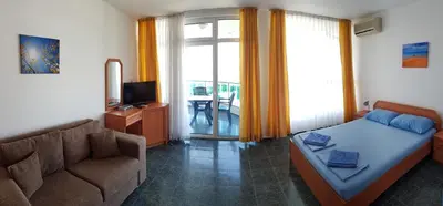 a living room with a bed and a couch at Riviera Complex 6 in Sveti Vlas