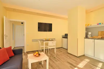 a living room with a couch and a table at Central studio #3 in Burgas City