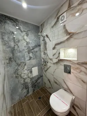 a bathroom with a toilet and a shower at Dracena Guesthouse in Ravda