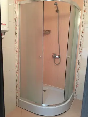 a shower with a glass door in a bathroom at Studio Martin in Pomorie