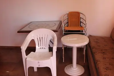 a table and two chairs and a table and a table at Abelia Residence Apartment Regina in Sunny Beach