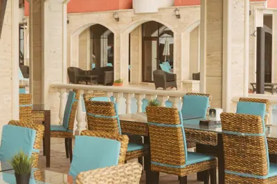 a group of chairs and a table in a room at Rich Collective in Nesebar
