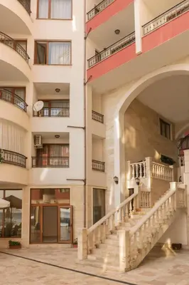 an external view of a building with a staircase at Rich Collective in Nesebar