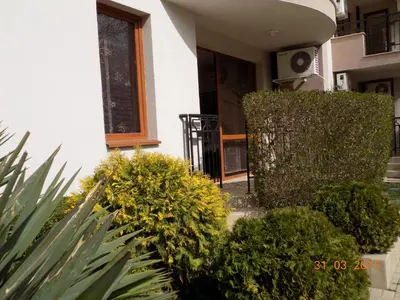 a house with a bunch of plants in front of it at Alex Deluxe Apartments in Sunny Beach