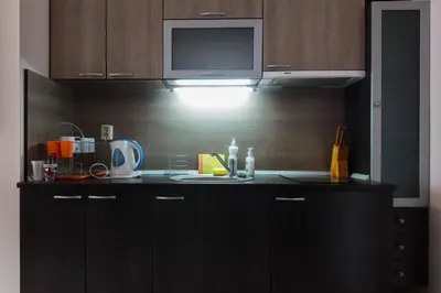 a kitchen with a sink and a microwave at Santa Sofia Studio in Sunny Beach