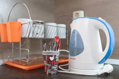 a kitchen counter with a mixer and a cup of pens at Santa Sofia Studio in Sunny Beach
