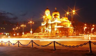 a large building with lights in front of it at night at Cathedral Guesthouse in Varna City