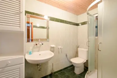 a bathroom with a sink and a toilet at Art Provence House in Lozenets